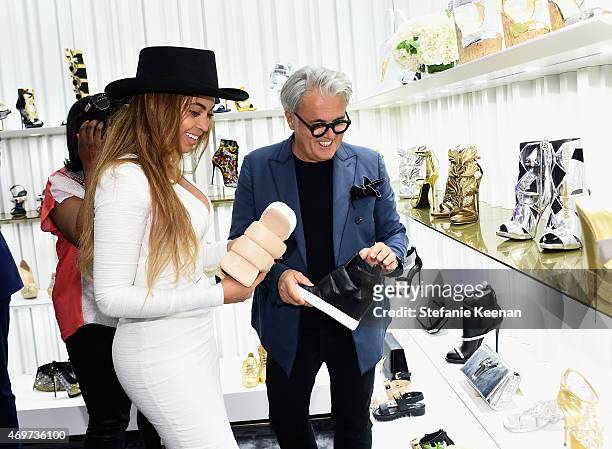 Singer Beyonce Knowles and Designer Giuseppe Zanotti attend the Giuseppe Zanotti Beverly Hills Store Opening on April 14, 2015 in Beverly Hills,...