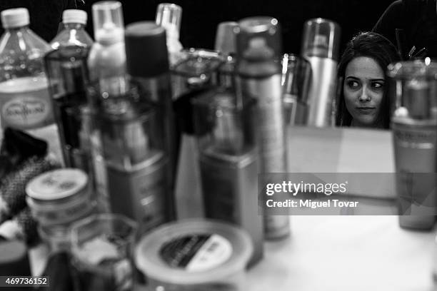 Model gets ready at the backstage during day one of Mercedes-Benz Fashion Week Mexico Fall/Winter 2015 at Campo Marte on April 14, 2015 in Mexico...