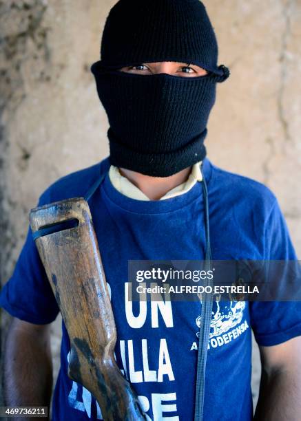 Former "puntero" of the Templar Knights drug cartel poses during an interview with AFP at la Nopalera community, Michoacan state, Mexico, on February...