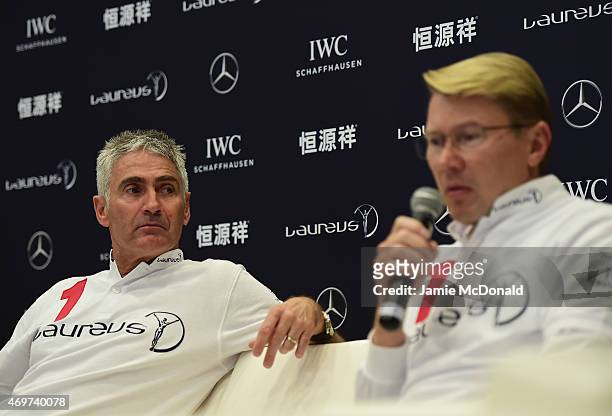 Laureus World Sports Academy members Mick Doohan and Mika Hakkinen talk during a media interview at the Shanghai Grand Theatre prior to the 2015...