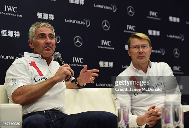 Laureus World Sports Academy members Mick Doohan and Mika Hakkinen talk during a media interview at the Shanghai Grand Theatre prior to the 2015...