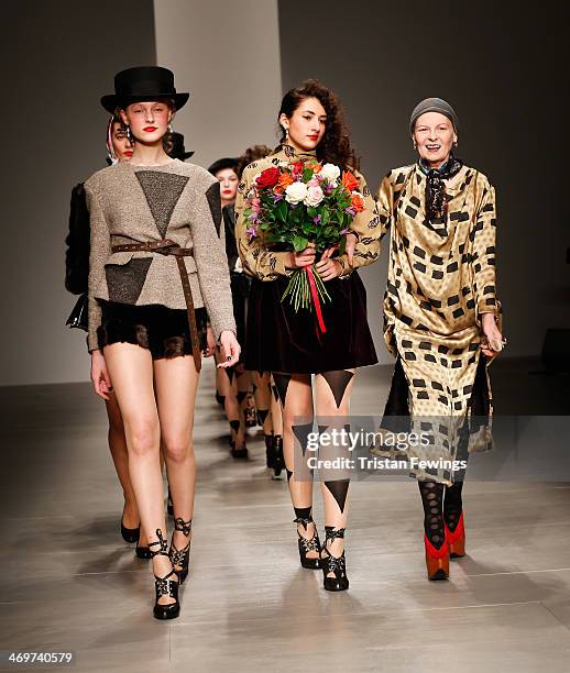 Designer Vivienne Westwood walks with models on the runway after the Vivienne Westwood Red Label show at London Fashion Week AW14 at on February 16,...