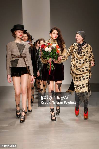 Designer Vivienne Westwood walks with models on the runway after the Vivienne Westwood Red Label show at London Fashion Week AW14 at on February 16,...