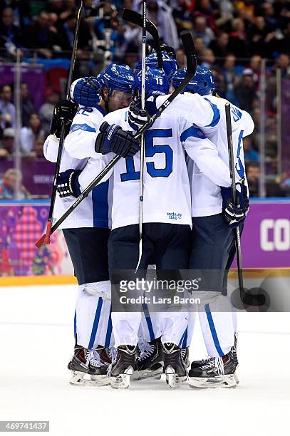 Tuomo Ruutu of Finland celebrates with his teammates after scoring a goal in the second period against Carey Price of Canada during the Men's Ice...