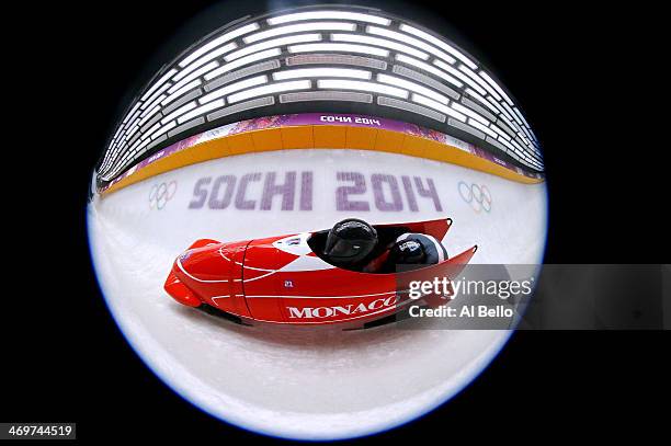 Pilot Patrice Servelle and Sebastien Gattuso of Monaco team 1 make a run during the Men's Two-Man Bobsleigh heats on Day 9 of the Sochi 2014 Winter...