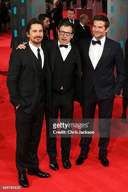 Actor Christian Bale, director David O. Russell and actor Bradley Cooper attend the EE British Academy Film Awards 2014 at The Royal Opera House on...