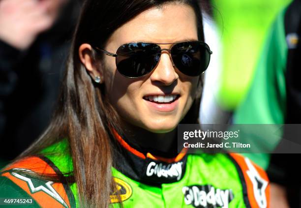 Danica Patrick, driver of the GoDaddy Chevrolet, stands in the garage area after qualifying for the NASCAR Sprint Cup Series Daytona 500 at Daytona...