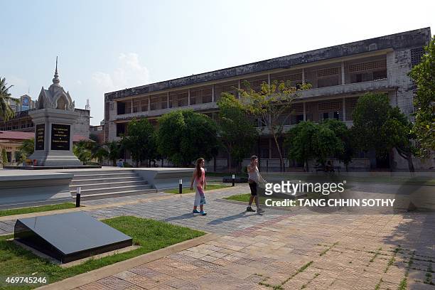 To go with Cambodia-KRouge-history,ADVANCER by Suy SE This photo taken on April 10, 2015 shows tourists visiting Tuol Sleng genocide museum in Phnom...