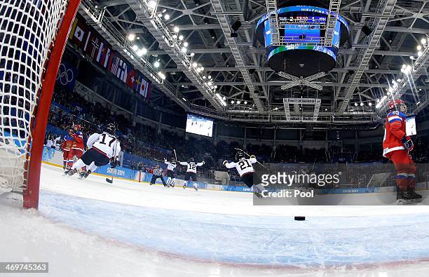 Ayaka Toko of Japan celebrates with teammates after scoring in the second period against Russia during the Women's Ice Hockey Classification game on...