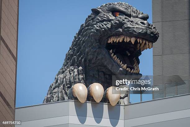 Meter tall Godzilla replica head is seen on the 8th floor terrace of the Hotel Gracery Shinjuku on April 15, 2015 in Tokyo, Japan. The Godzilla...