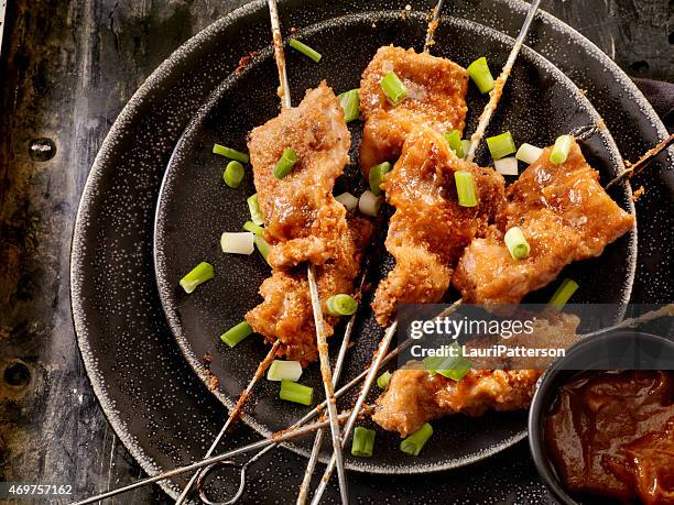 chicken skewers with peanut sauce - chicken satay stock pictures, royalty-free photos & images