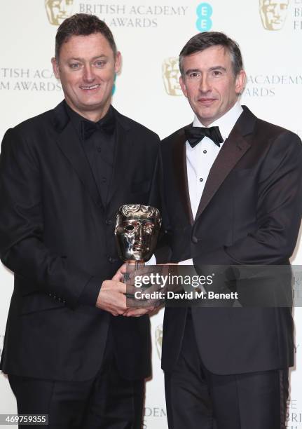 Jeff Pope and Steve Coogan winners of the Best Adapted Screenplay award, poses in the winners room at the EE British Academy Film Awards 2014 at The...