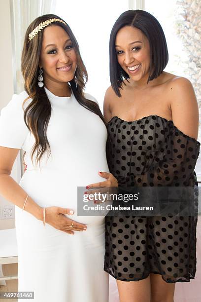 Tamera Mowry-Housley and Tia Mowry attend Tamera Mowry-Housley's baby shower at Casa Del Mar on April 4, 2015 in Santa Monica, California.