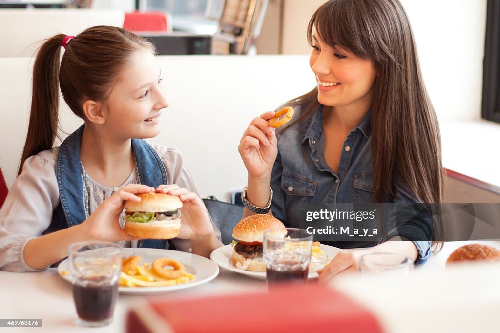 A mother with her daughter at a restaurant