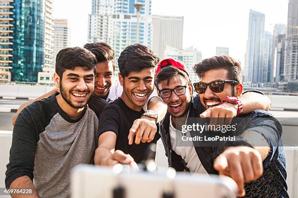 friends taking a selfie in dubai marina during a vacation - arab community life bildbanksfoton och bilder