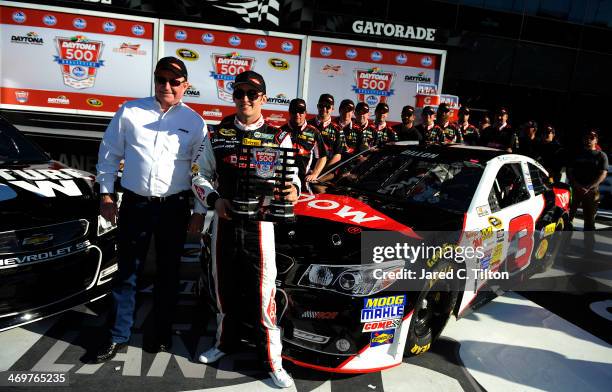 Austin Dillon, driver of the DOW Chevrolet, celebrates in Victory Lane with team owner Richard Childress after winning pole position for the NASCAR...