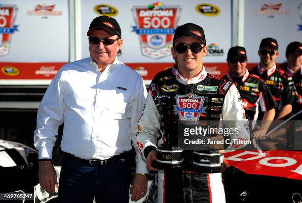 Austin Dillon, driver of the DOW Chevrolet, celebrates in Victory Lane with team owner Richard Childress after winning pole position for the NASCAR...