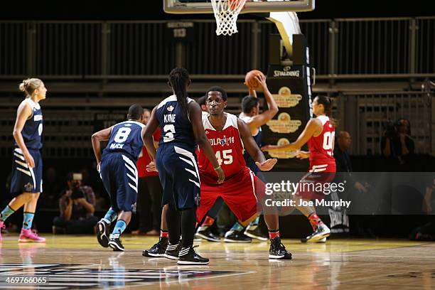 Legend A.C. Green of the West Team defends against the East Team during the NBA Cares Special Olympics Unified Sports Basketball Game at Sprint Arena...