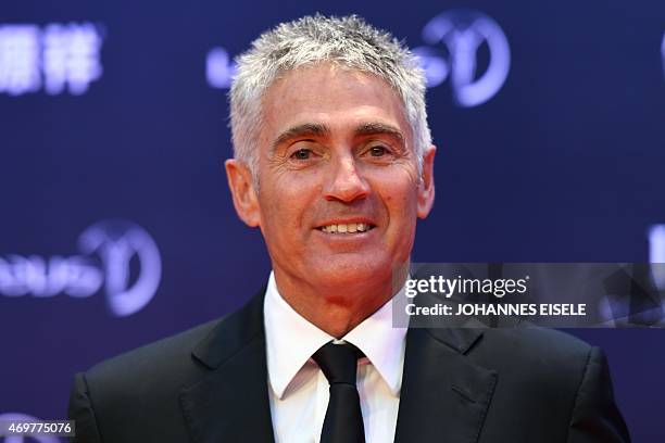 Former MotoGP driver Mick Doohan poses on the red carpet as he arrives ahead of the Laureus World Sports Award ceremony at the Grand Theater in...