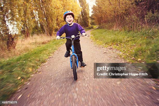 cycling home - kids on bikes stock pictures, royalty-free photos & images