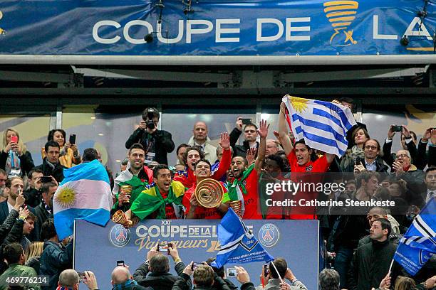 Thiago Silva, captain of Paris Saint-Germain FC lifts up the Coupe de la Ligue Trophy with Marquinhos, Salvatore Sirigu, Adrien Rabiot, Lucas, Serge...