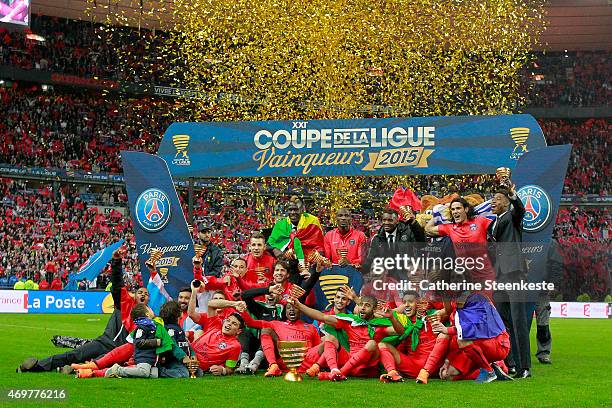 The Paris Saint-Germain FC poses for a photo with the Coupe de la Ligue Trophy after the French League Cup Final game between SC Bastia and Paris...