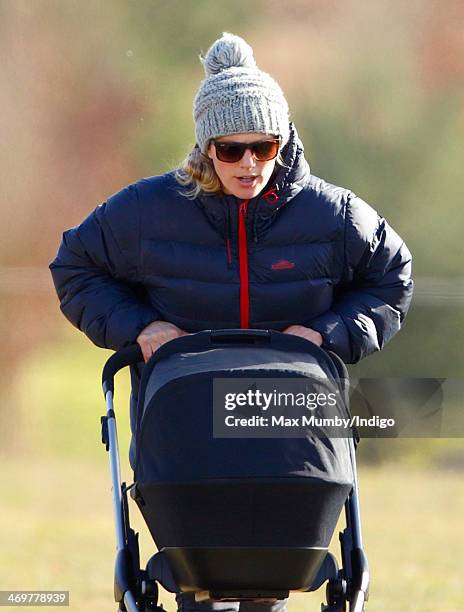 Zara Phillips pushes her baby daughter Mia Tindall in her pushchair as she attends the Barbury Castle Point-to-Point race meeting at Barbury...