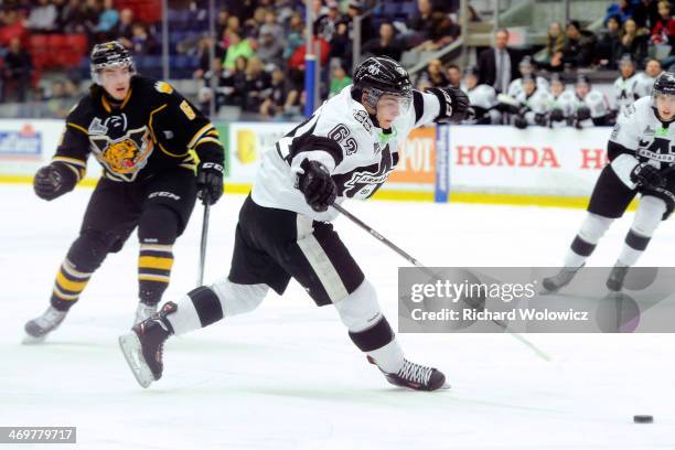 Danick Martel of the Blainville-Boisbriand Armada falls while skating with the puck during the QMJHL game against the Victoriaville Tigres at the...