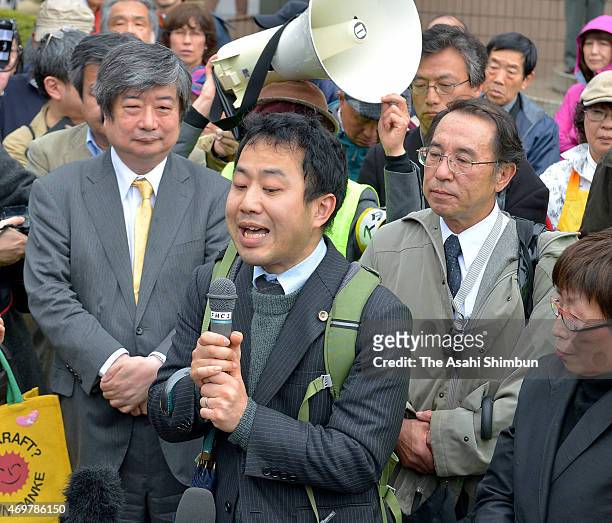 Kazuhiro Kasahara, a lawyer representing plaintiffs, speaks after the Fukui District Court's ruling against the restarts of two reactors at the...