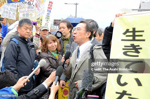 Plaintiffs celebrate after the Fukui District Court's ruling against the restarts of two reactors at the Takahama nuclear power plant on April 14,...