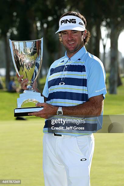 Bubba Watson poses with the trophy after winning the Northern Trust Open at the Riviera Country Club on February 16, 2014 in Pacific Palisades,...