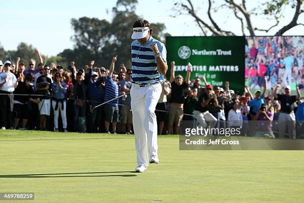 Bubba Watson celebrates his birdie putt on the 18th green to win the final round of the Northern Trust Open at the Riviera Country Club on February...