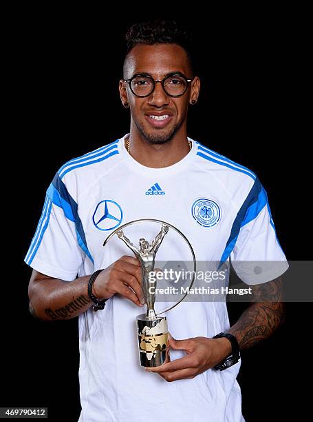 Jerome Boateng of Germany, winners of the Laureus World Team of the Year 2015 poses with the award at the Villa Kennedy hotel on March 23, 2015 in...