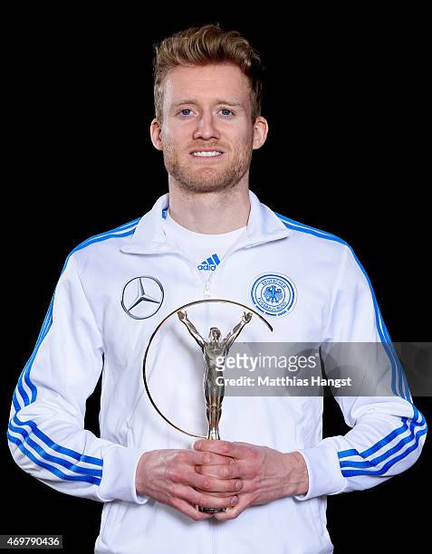 Andre Schurrle of Germany, winners of the Laureus World Team of the Year 2015 poses with the award at the Villa Kennedy hotel on March 23, 2015 in...