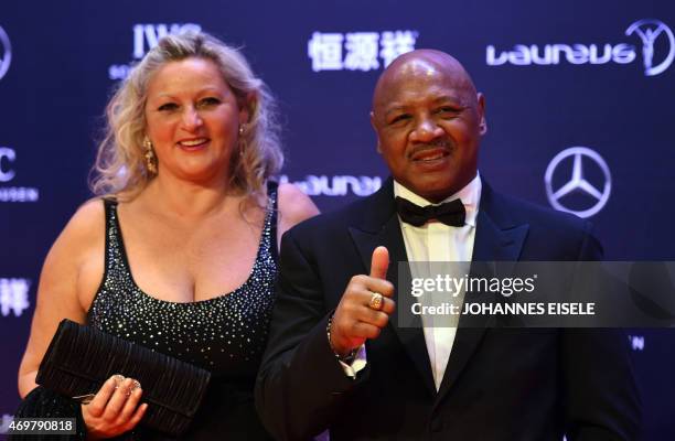 Former boxing champion Marvin Hagler and his wife Kay Guarrera pose on the red carpet ahead of the Laureus World Sports Award ceremony at the Grand...