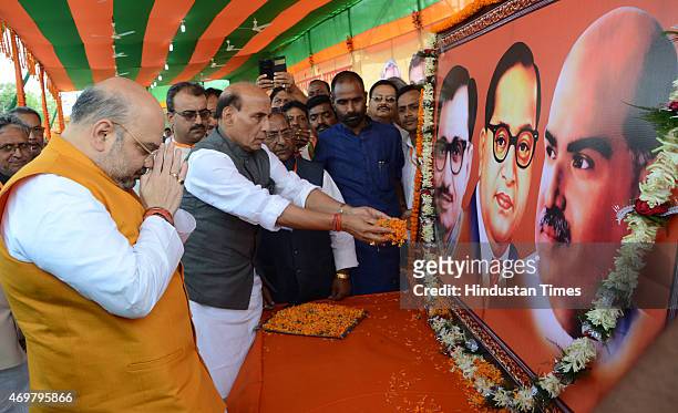 National President Amit Shah and Union Home Minister Rajnath Singh paying floral tributes to the Portraits of Pandit DeenDayal Upadhyaya, Bhimrao...