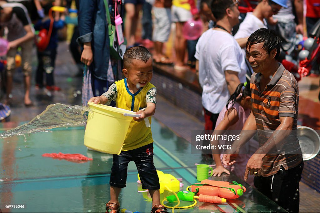 People Celebrate Traditional Water-Sprinkling Festival In Yunnan