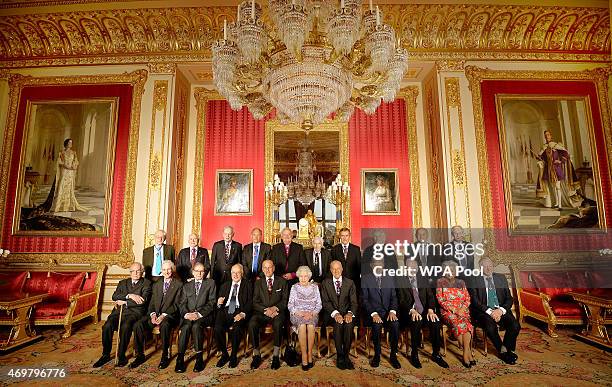 Queen Elizabeth II with members of the Order of Merit Professor Sir Michael Howard, Lord May of Oxford, Professor Sir Roger Penrose, Sir Michael...