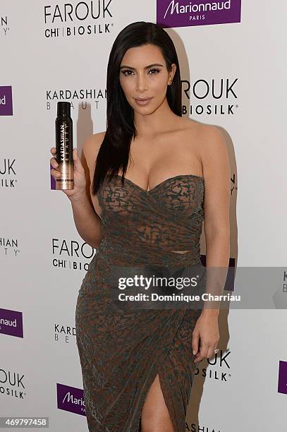 Kim Kardashian introduces 'Kardashian Beauty Hair' line at Marionnaud Champs Elysees on April 15, 2015 in Paris, France.