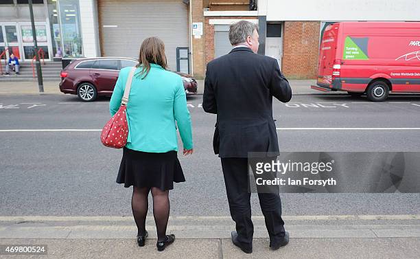Shadow Chancellor Ed Balls waits to cross the road with Labour candidate Anna Turley during a visit to the seafront on April 15, 2015 in Redcar,...