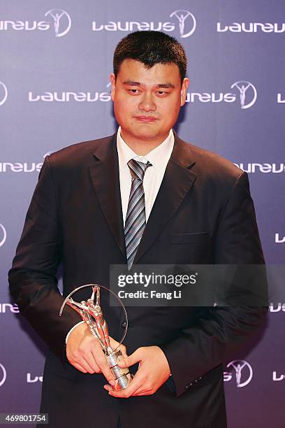 Former Basketball player Yao Ming of China with his Laureus Spirit of Sport award at the winners photocall during the 2015 Laureus World Sports...