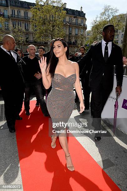 Kim Kardashian arrives to introduce her 'Kardashian Beauty Hair' line at Marionnaud Champs Elysees on April 15, 2015 in Paris, France.