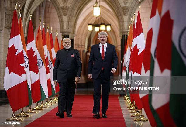 India's Prime Minister Narendra Modi , walks the Hall of Honour on Parliament Hill alongside Canada's Prime Minister Stephen Harper in Ottawa, Canada...