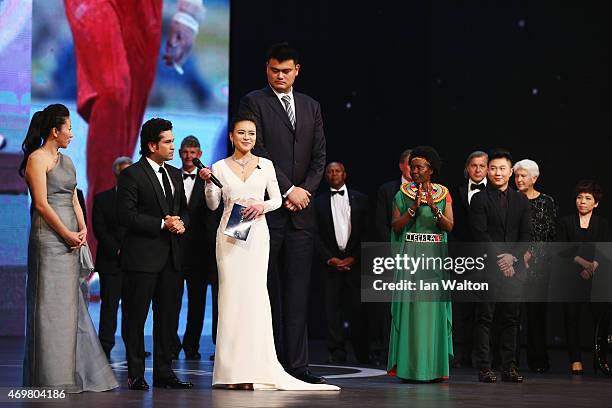 Presenter Chen Chen speaks with new Laureus Academy member Sachin Tendulkar with former Basketball player Yao Ming of China and Laureus World Sports...