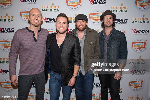 Musicians Jon Jones, Mike Eli, James Young and Chris Thompson of the Eli Young Band pose at the "Reba and Friends Outnumber Hunger" concert event on...