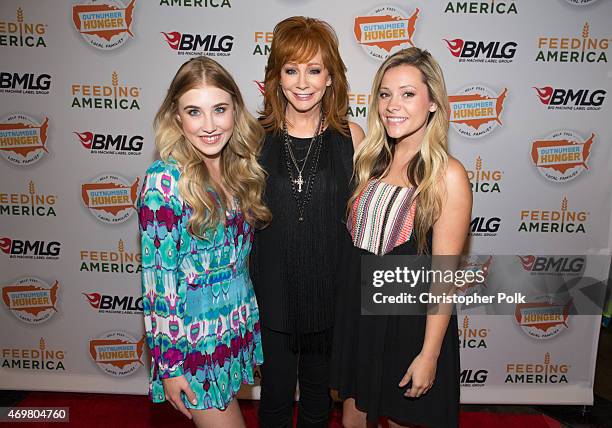 Vocalists Madison Marlow and Taylor Dye of the musical duo Maddie and Tae pose with entertainer Reba McEntire at the "Reba and Friends Outnumber...