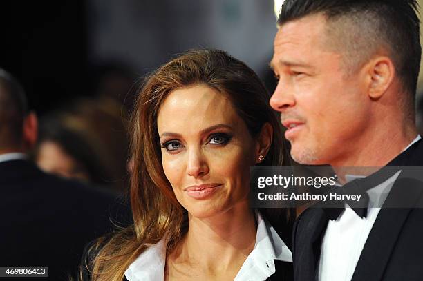 Actors Angelina Jolie and Brad Pitt attend the EE British Academy Film Awards 2014 at The Royal Opera House on February 16, 2014 in London, England.