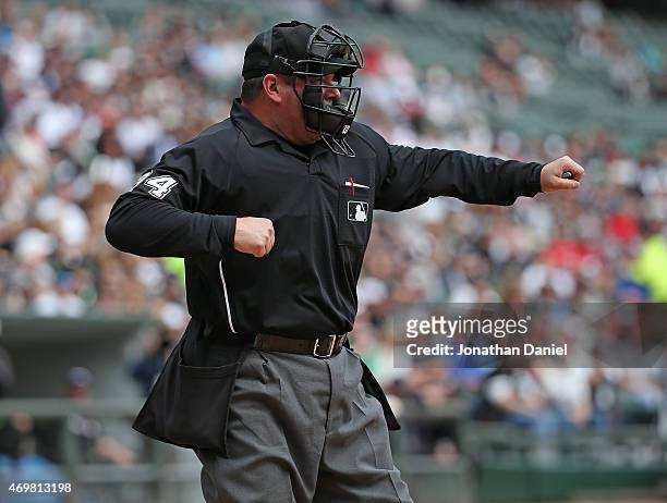 Home plate umpire Sam Holbrook calls a player out on strikes during a game between the Chicago White Sox and the Minnesota Twins at U.S. Cellular...
