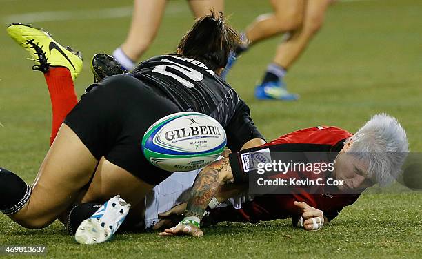Carla Hohepa of New Zealand tackles Jennifer Kish of Canada during the Women's Sevens World Series at Fifth Third Bank Stadium on February 16, 2014...