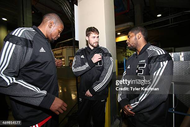 Kevin Durant, Kevin Love of the Western Conference All-Stars and Kyrie Irving of the Eastern Conference All-Stars chat prior to the 2014 NBA All-Star...